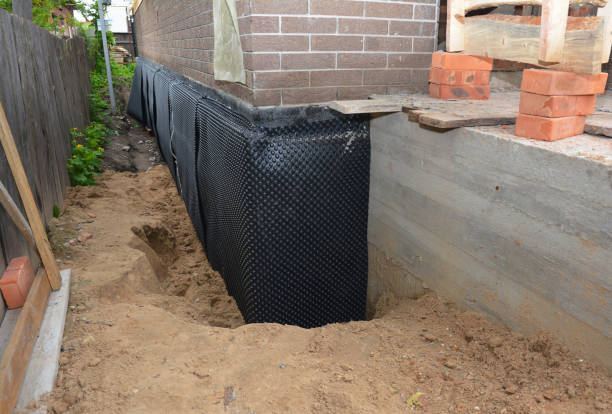 Happy homeowners after waterproofing job in Vaughnsville